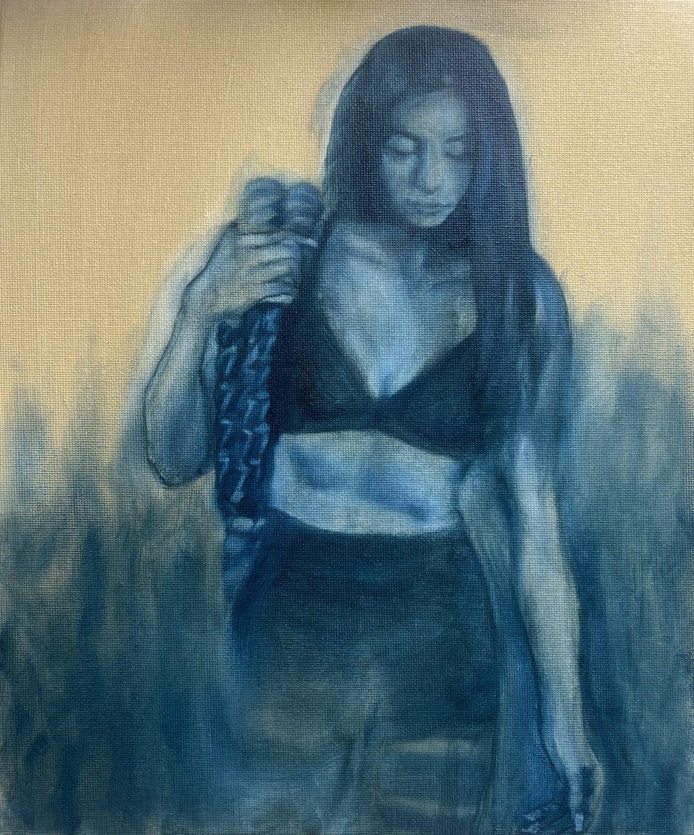 A portrait underpainting in blue — the first stage of the painting process